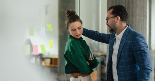 man making woman uncomfortable at work